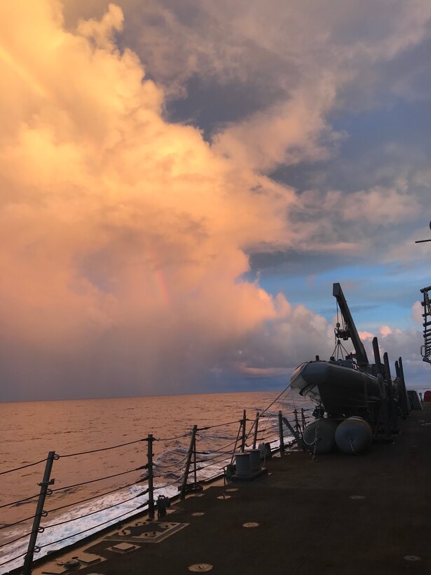A sunset is visible from USS Barry (DDG 52).