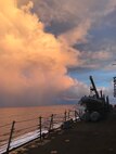 A sunset is visible from USS Barry (DDG 52).