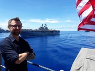 Brian Mills, a naval architect from Naval Surface Warfare Center, Carderock Division, stands aboard USS Antietam.