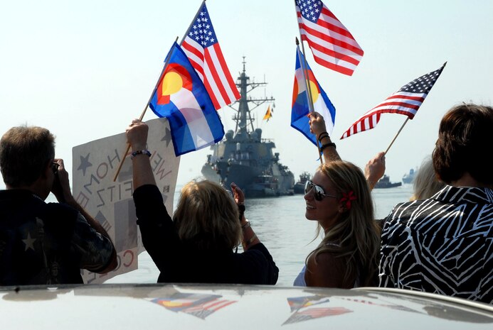 Family and friends welcome home Sailors aboard the guided-missile destroyer USS Cole (DDG 67).