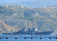 The guided missile destroyer USS Cole (DDG 67) arrives for a scheduled port visit in Soudda Bay, Crete, Greece.