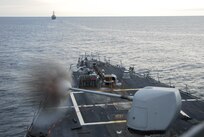 he guided missile destroyer USS Cole (DDG 67) fires its 5-inch gun at a target in the Atlantic Ocean during a live-fire exercise Feb. 23, 2014.