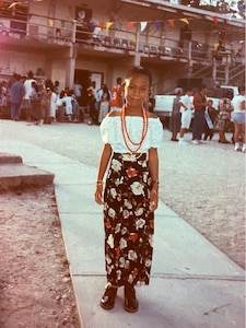 Sgt. 1st Class Denise Ronneburg in front of La Immaculada Primary School in Orange Walk, Belize, circa 1996.