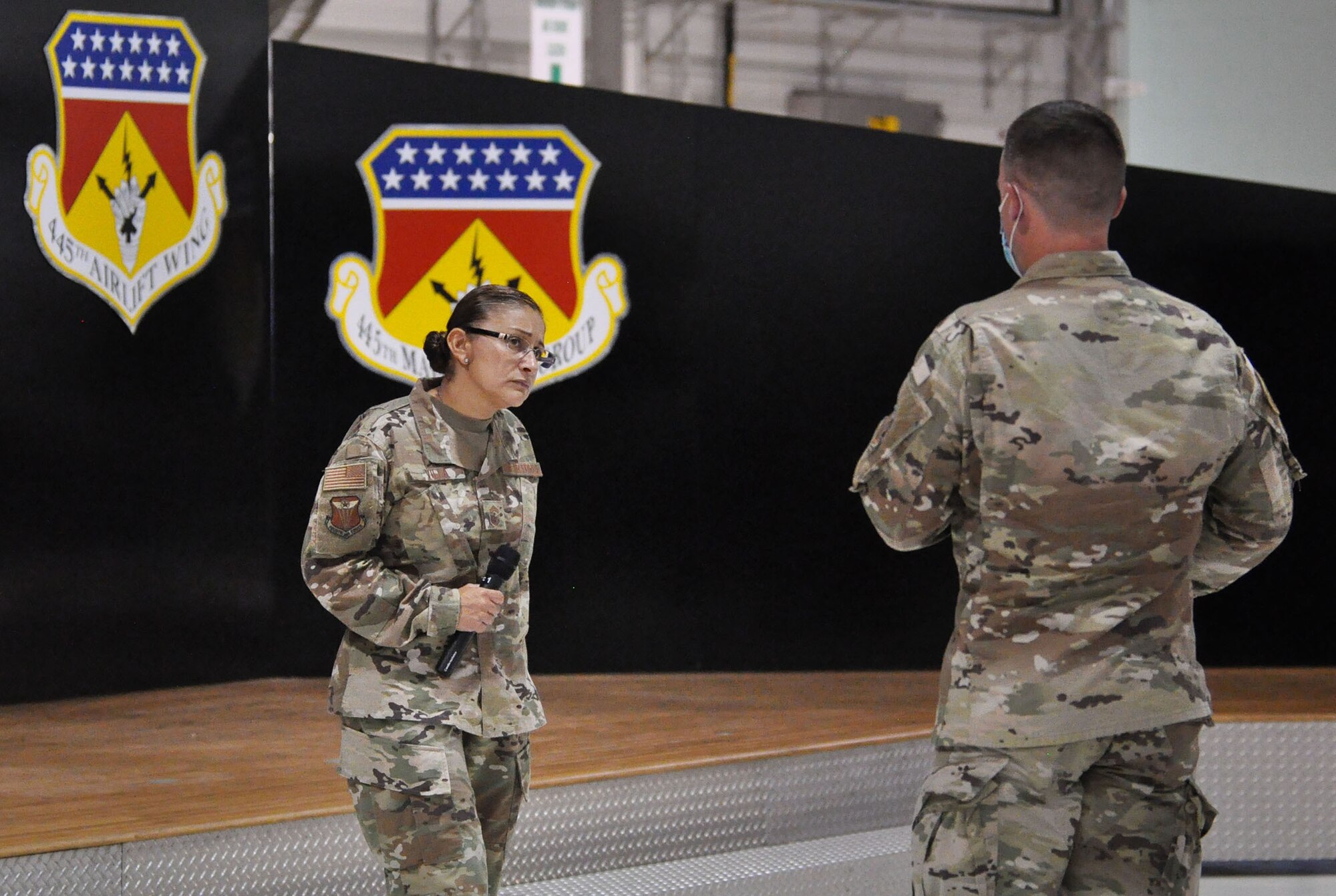 Chief Master Sgt. Cynthia Villa, 4th Air Force command chief, answers questions from the audience at a socially distanced enlisted call with Reserve Citizen Airmen of the 445th Airlift Wing, Sept. 12, 2020 at Wright-Patterson Air Force Base, Ohio.