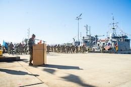 Col. James Peckham Jr., G3, 1st Theater Sustainment Command, delivers a speech during a welcome home ceremony for the Army Mariners of the 411th and 335th Transportation Detachments at Joint Base Langley-Eustis, Virginia, Oct. 8, 2020.  Peckham spoke to the many accomplishments of the units during their tenure in support of the mission in the U.S. Central Command and U.S. Army Central area of operation in the Middle East.  The crews made the 10,000 nautical mile trek aboard the Maj. Gen. Charles P. Gross (LSV 5) and the SP4 James A. Loux (LSV 6), which were the last of the LSVs to redeploy from Kuwait back to the U.S. in support of the Army’s watercraft modernization strategy.