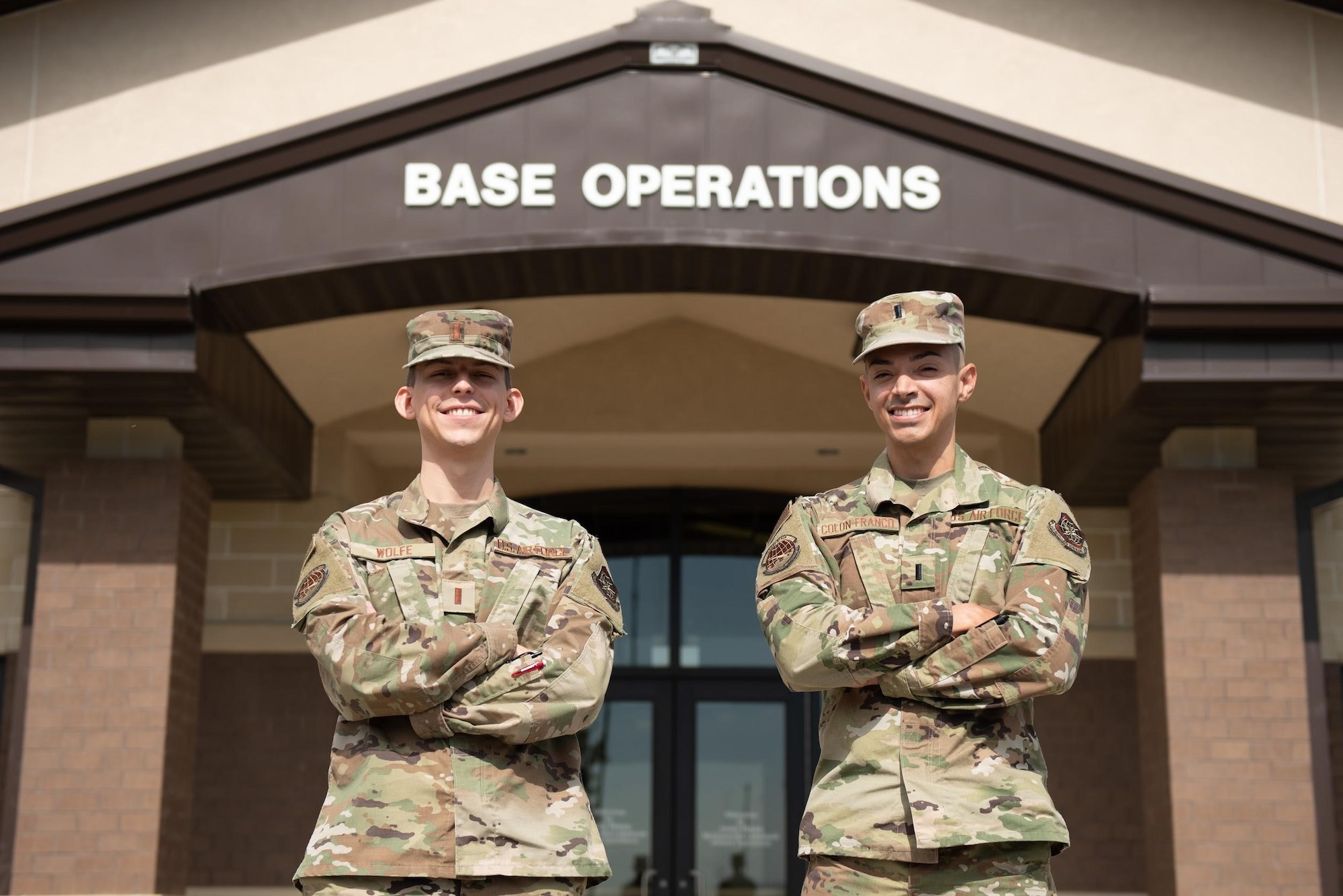 Two Air Force officers pose for a photo.