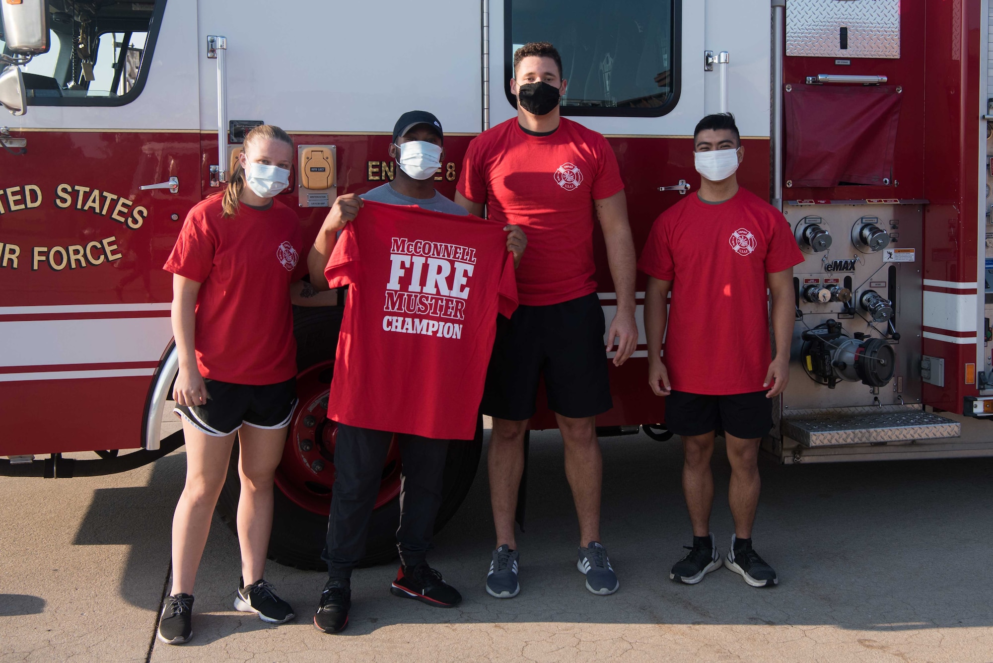 From left to right, Senior Airman Megan Galasso, Senior Airman Tyler Cogdelo, Senior Airman Nicholas Summit, 22nd Maintenance Squadron aerospace ground equipment journeymen, and Airman 1st Class Chris Padilla, 22nd MXS AGE apprentice, pose for a photo Oct. 8, 2020, at McConnell Air Force Base, Kansas. The team won McConnell’s 2020 Fire Muster with the fastest time of the day with 2 minutes and 52 seconds. (U.S. Air Force photo by Senior Airman Alexi Bosarge)