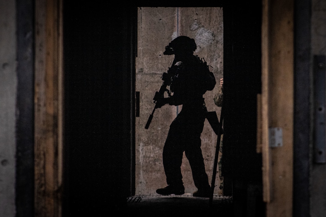 A U.S. Marine searches a room during a house clearing exercise on Camp Hansen, Okinawa, Japan, Oct. 7.