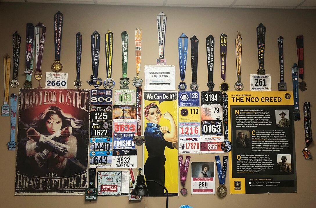 Sgt. 1st Class Dianna Smith, 7th/95th Battalion, 4th Brigade (Personnel Services), 94th Training Division – Force Sustainment, showcases her medals from her 25 virtual races. Smith hopes to be a motivation and inspiration for other Army Reserve Soldiers to achieve their goals.