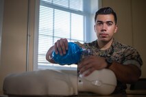 HM3 Alan M. Garcia, an/a assistant operations chief with operations and training, 2D Dental Battalion, 2D MLG, poses for a photo on Camp Lejeune, N.C., October 1, 2020. “We rise by lifting others!,” said Garcia, a Phoenix, Ariz., native. According to his leadership, Garcia is instrumental to the success of Operations and Training.  As Ammunitions Chief, he expertly supported both M9 and CBRNE ranges essential for watch standing and unit training requirements.  A qualified BLS instructor, assisted in two Healthcare Provider courses that certified 12 personnel and coordinated Command and MLG Indoctrination for 18 Sailors.  HM3 Garcia's hard work and determination were vital to the continued success of the Operations/ Training department and the mission readiness of the Battalion!. (U.S. Marine Corps photo by LCpl Scott R. Jenkins)