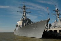 The Arleigh Burke-class guided-missile destroyer USS Cole is pierside at Naval Station Norfolk before departing on a scheduled seven-month deployment. Cole will operate in the Mediterranean Sea and the Persian Gulf during her deployment conducting maritime security operations. (Photo by: Seaman Scott Pittman)
