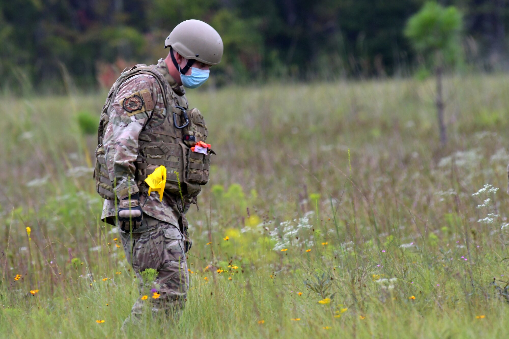 Staff Sgt. Derek Miller, 94th EOD Flight technician, searches an area for any explosive material at Fort Stewart, Georgia, Sept. 16, 2020. Throughout the exercise, members went through numerous tasks such as working with electric demolition procedures, non-electric demolition procedures, demolition shape charges and cratering charges. (U.S. Air Force photo by Airman 1st Class Kendra A. Ransum)