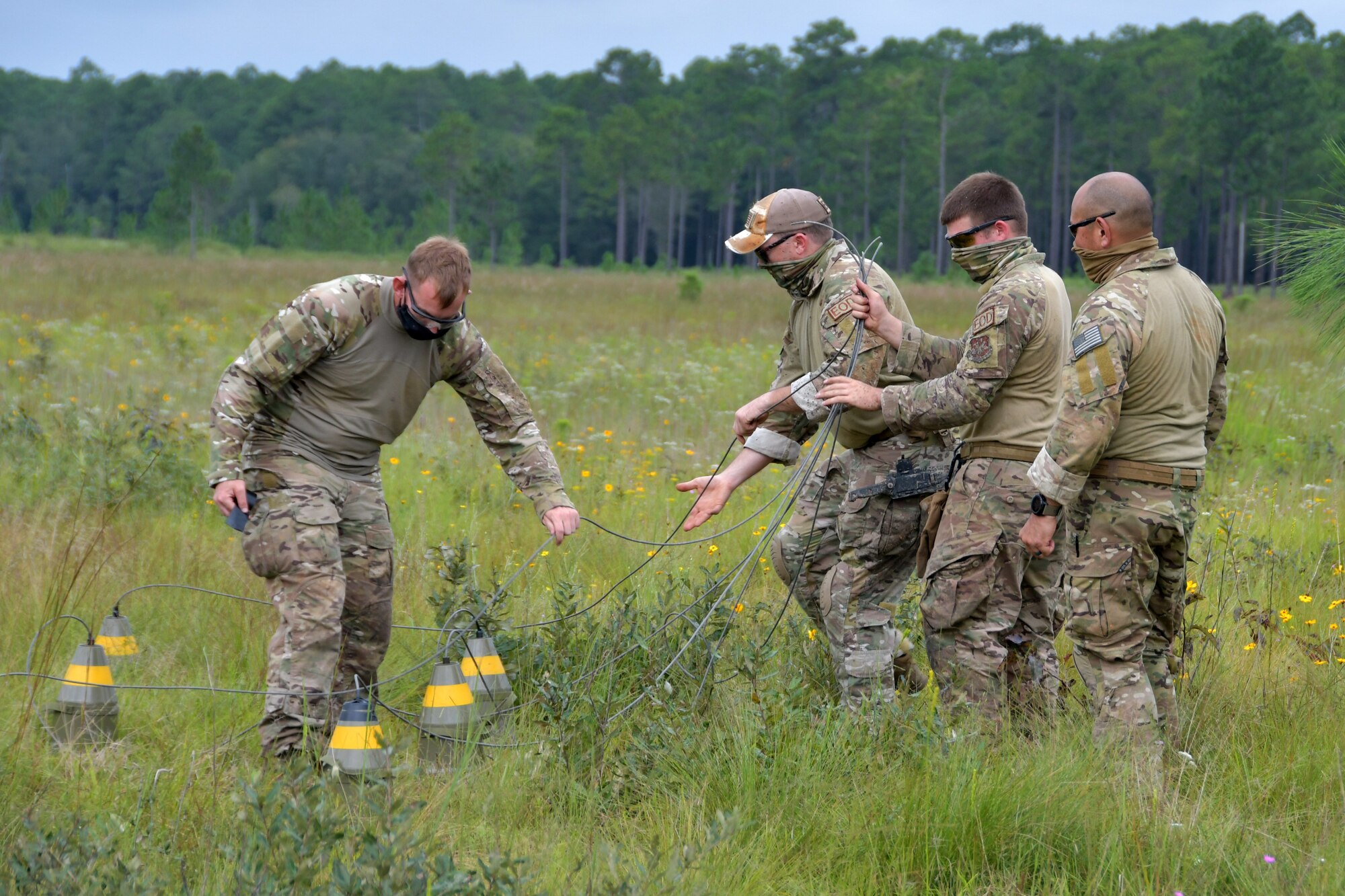 Members of the 94th EOD Flight prepare shape charges during an EOD training exercise at Ft. Stewart, Georgia, Sept. 17, 2020. Throughout the exercise, members went through numerous tasks such as working with electric demolition procedures, non-electric demolition procedures, demolition shape charges and cratering charges. (U.S. Air Force photo by Airman 1st Class Kendra A. Ransum)