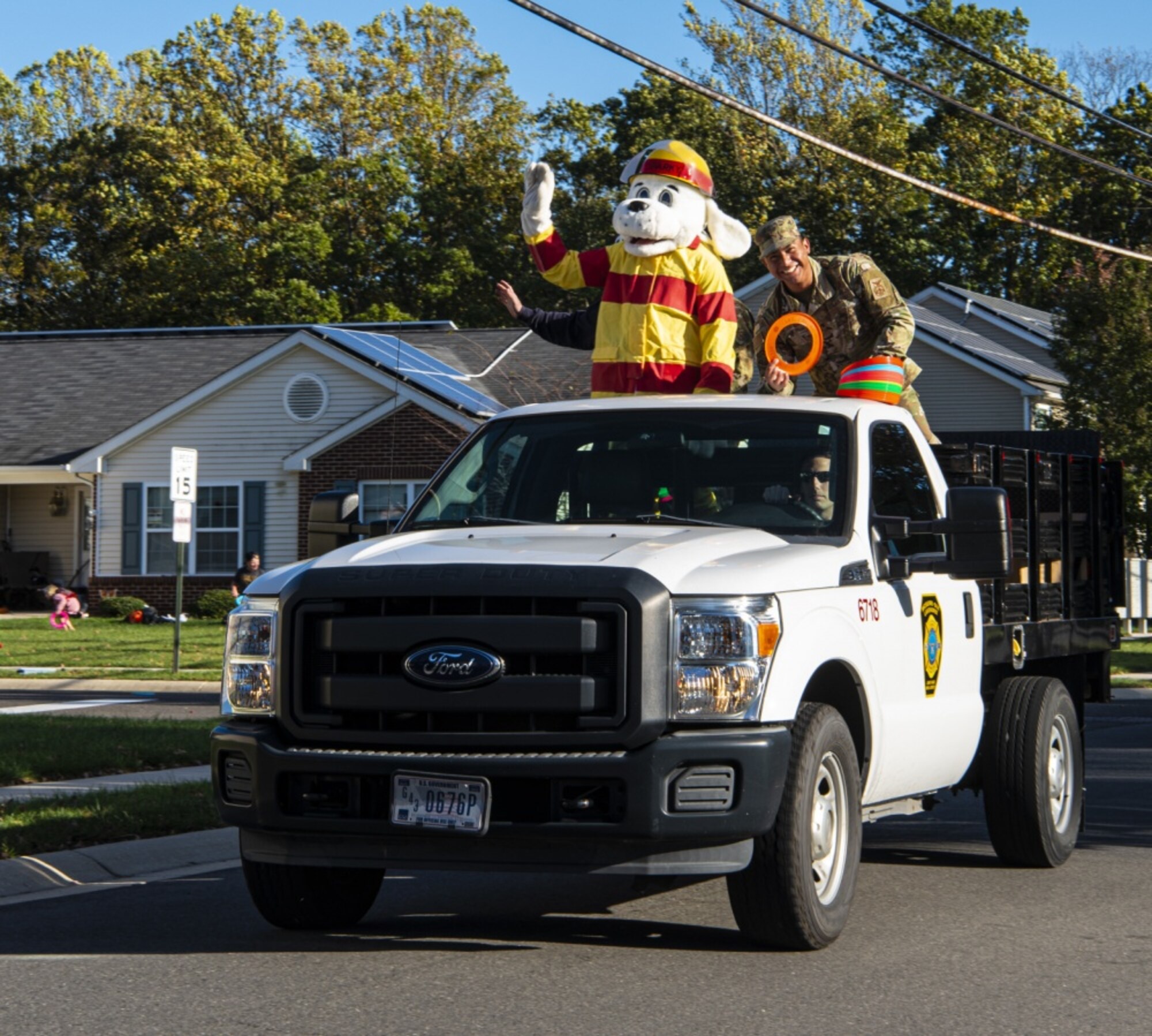 Photo of Sparky the Fire Dog waving.