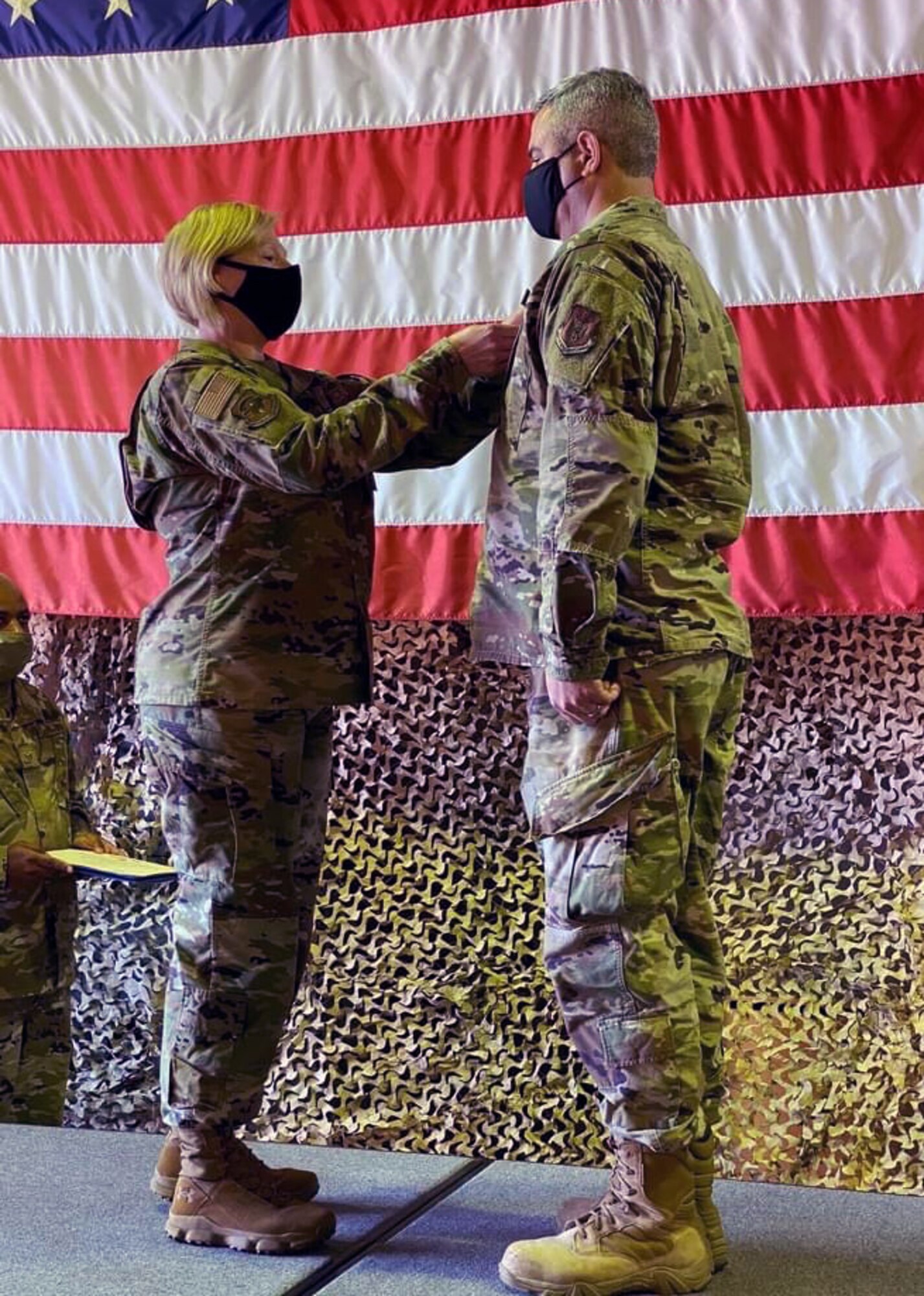 Col. Ann Brown, 459th Mission Support Group commander, pins a Bronze Star on Maj. Russell Pangburn, 759th Logistics Readiness Flight, Oct. 4, 2020, at Joint Base Andrews, Md. Pangburn was awarded the Bronze Star for his for his meritorious achievement while deployed to Iraq and Syria in support of Operation Inherent Resolve from Sept. 2019 to April 2020. (U.S. Air Force Photo/Staff Sgt. Cierra Presentado)