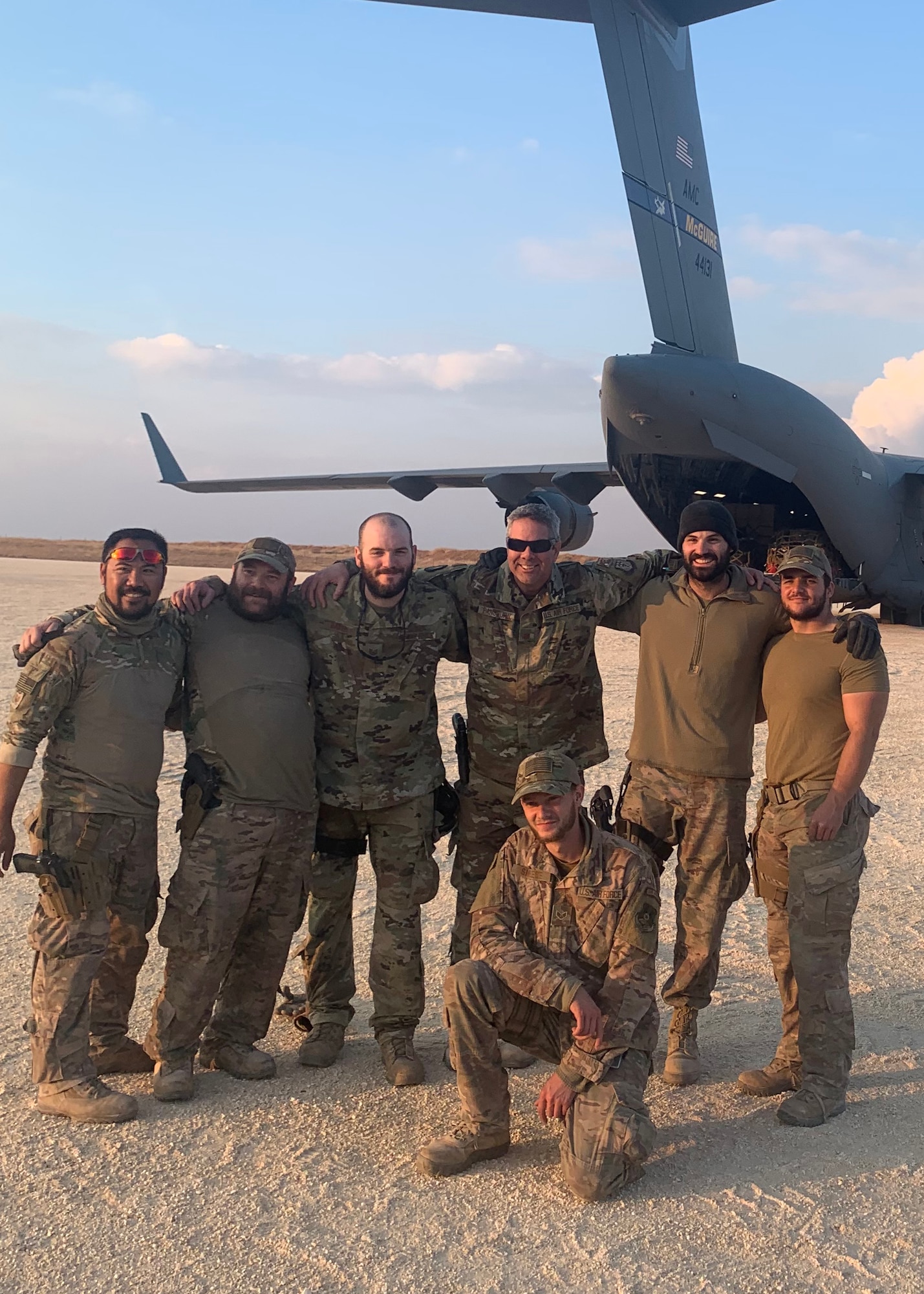 Maj. Russel Pangburn, 759th Logistics Readiness Flight, poses for a photo with his team while on deployment to Syria. Major Pangburn was awarded the Bronze Star for his meritorious achievement while deployed to Iraq and Syria in support of Operation Inherent Resolve from Sept. 2019 to April 2020. (Courtesy Photo)