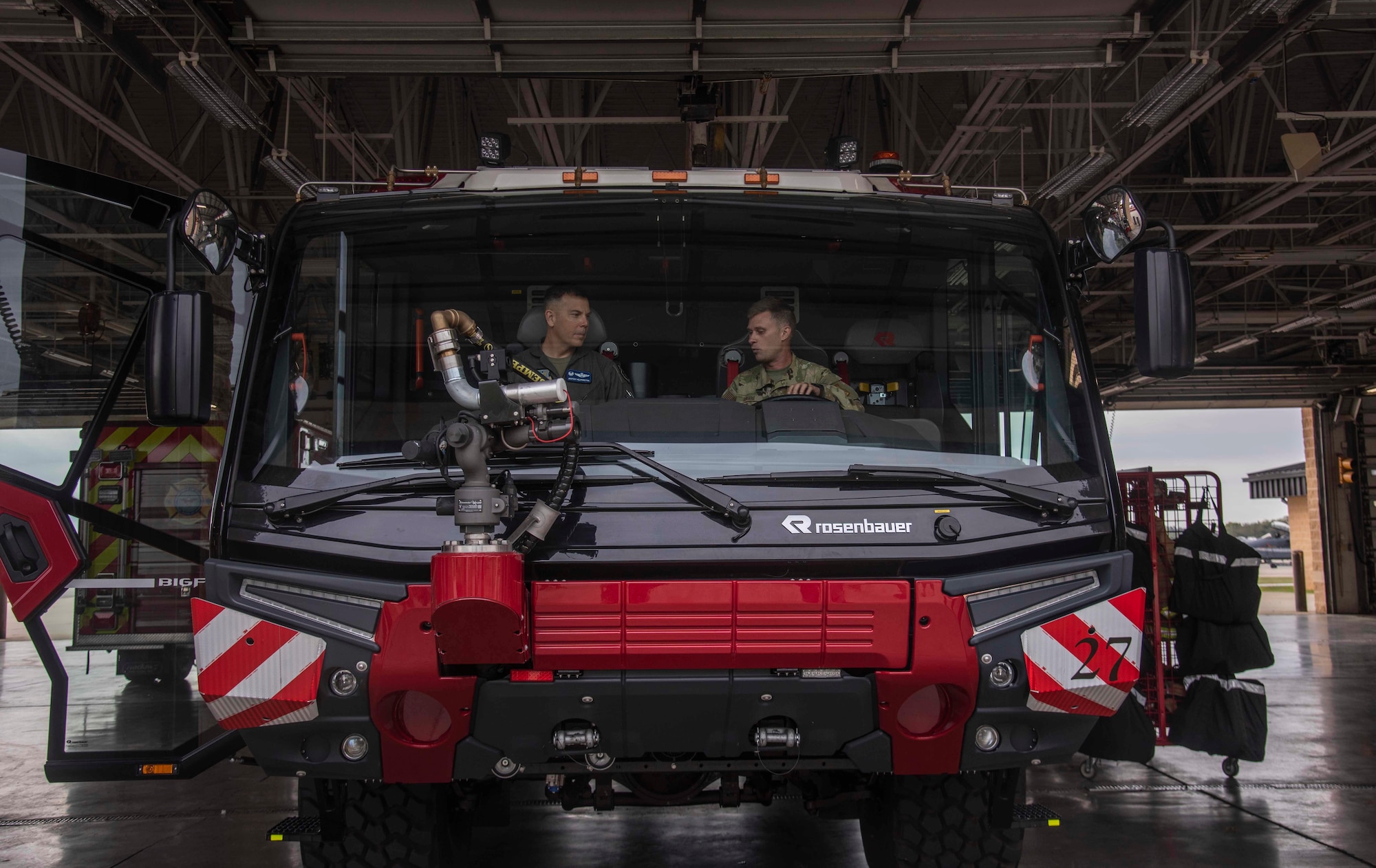 Col. Kurt Helphinstine, 4th Fighter Wing commander (left), receives a demonstration of the new firetruck from Staff Sgt. Justin Davis, 4th Civil Engineer Squadron fireman (right), at Seymour Johnson Air Force Base, N.C., Oct. 9, 2020. The new truck, which replaced one of the older trucks at the fire department, is top of the line and allows the 4th CES fire department to support the 4th FW mission faster and more efficiently. (U.S. Air Force photo by Senior Airman Kylee Gardner)