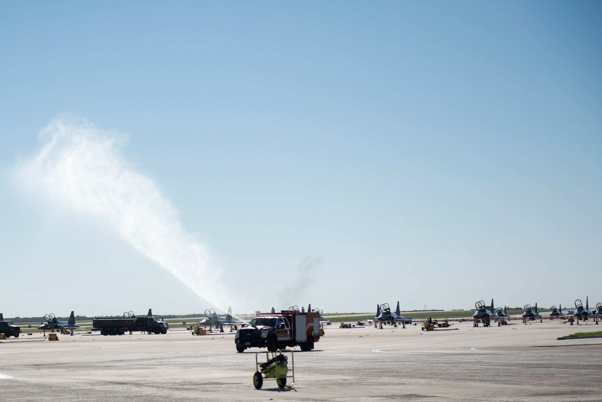 Firefighters hurry to a scenario on the flight line as a training exercise to help sharpen and hone their skills, Sept. 30, 2020, at Laughlin Air Force Base, Texas. The firefighters treat all training exercise as they were real emergencies (U.S. Air Force photo by Airman 1st Class David Phaff)