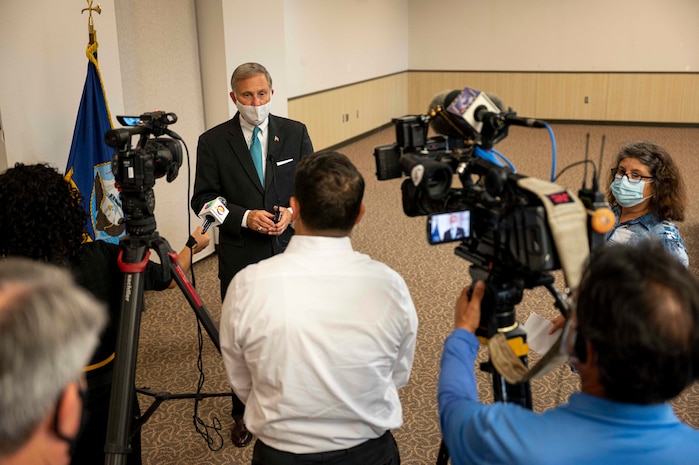 Acting Under Secretary of the Navy Gregory J. Slavonic speaks to media after an award ceremony at Naval Air Station Corpus Christi.