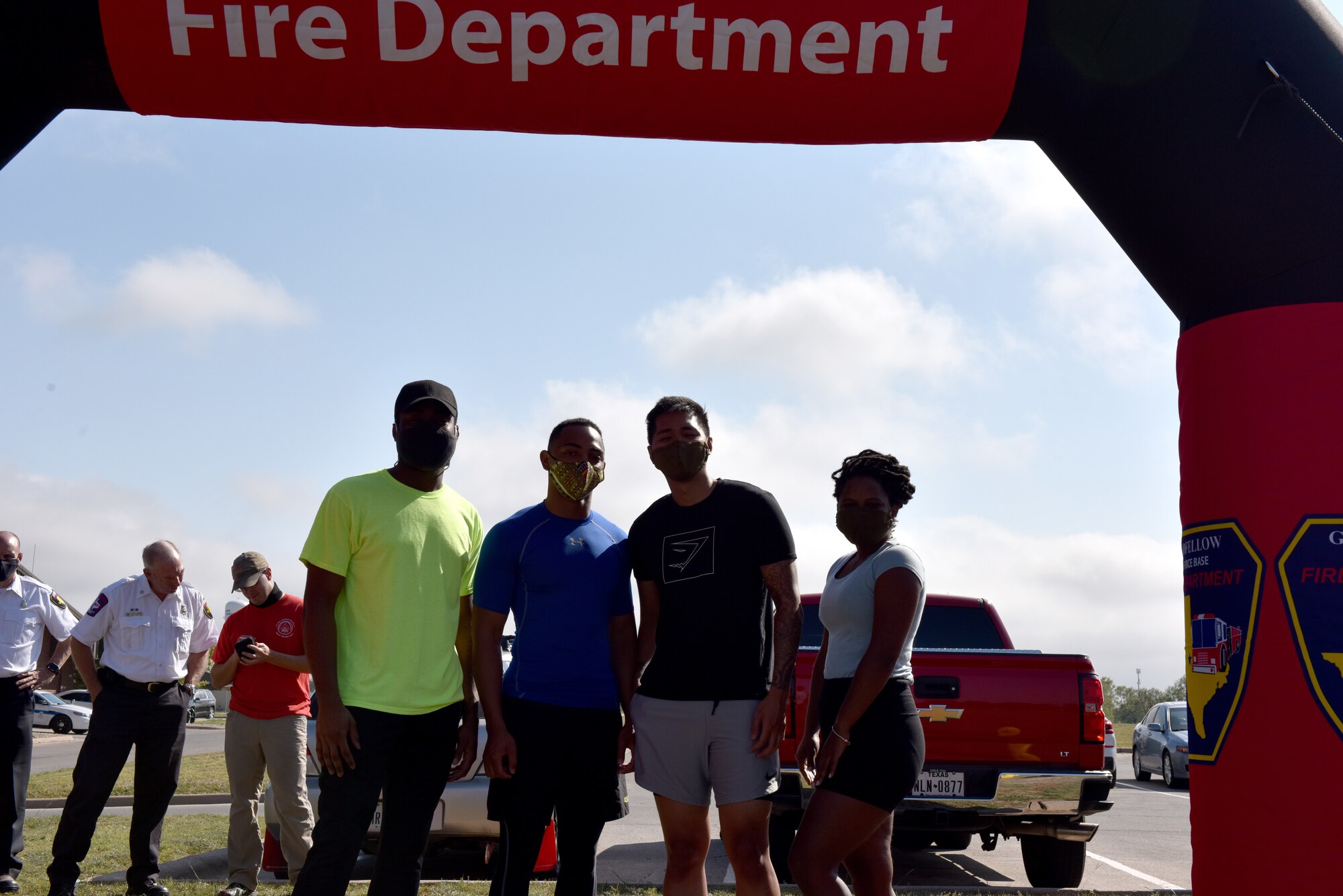 The last team to run the obstacle course poses for a picture before taking part in the 15th Annual Fire Muster Challenge at the Goodfellow Fire Department on Goodfellow air Force Base, Texas, Oct. 9, 2020. The obstacles were designed to show individuals what firefighters go through everyday. (U.S. Air Force photo by Staff Sgt. Seraiah Wolf)