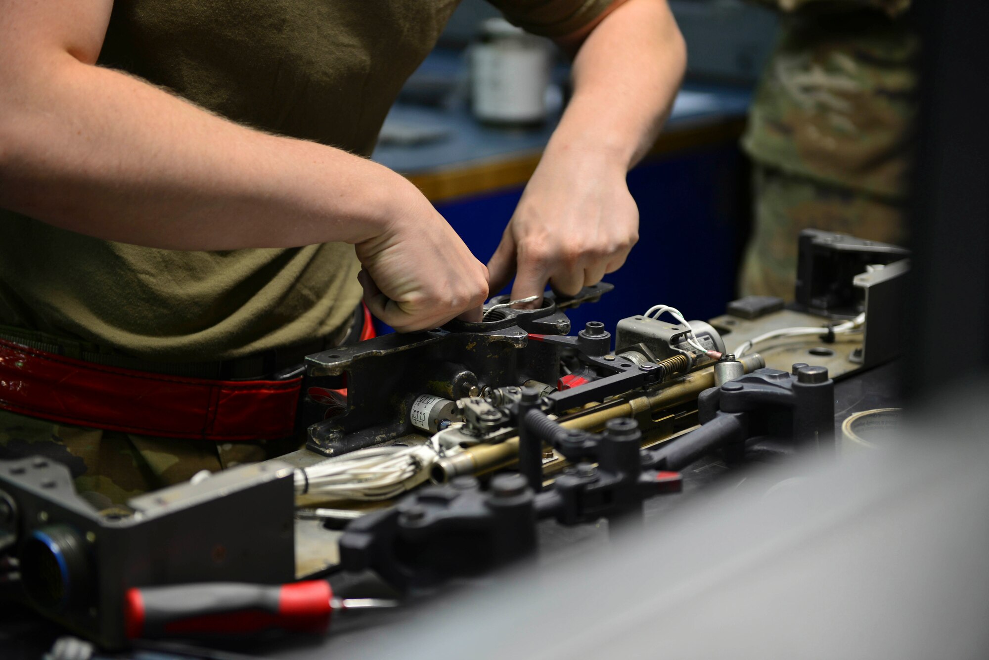 U.S. Air Force Airman 1st Class Britian Lee Abell, a 354th Maintenance Squadron (MXS) armament technician, reassembles bomb rack switches at Eielson Air Force Base, Oct. 7, 2020.