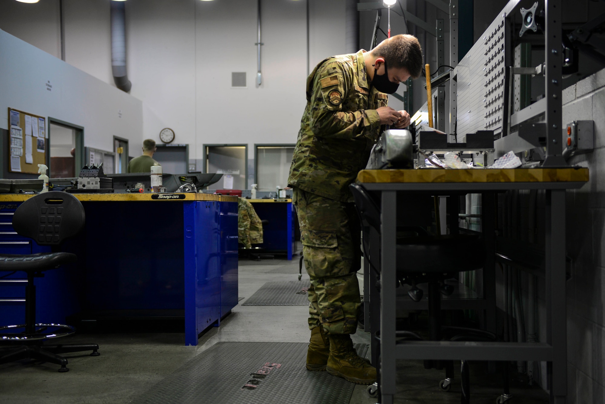 U.S. Air Force Airman 1st Class Koby Gossett, a 354th Maintenance Squadron (MXS) armament floor technician, replaces a wire at Eielson Air Force Base, Oct. 7, 2020.