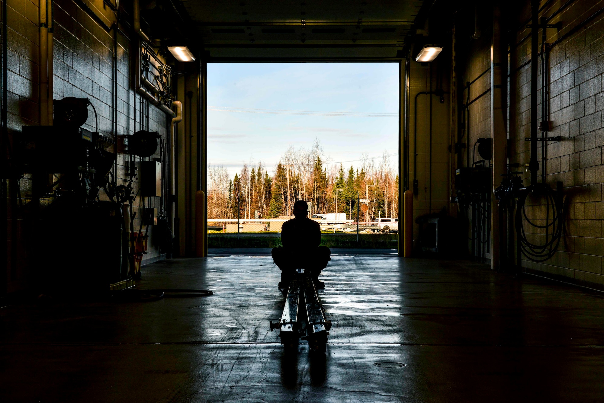 U.S. Air Force Airman 1st Class Matthew Washington, a 354th Maintenance Squadron (MXS) Aerospace Ground Equipment craftsman, lifts a tow bar at Eielson Air Force Base, Alaska, Oct. 8, 2020.