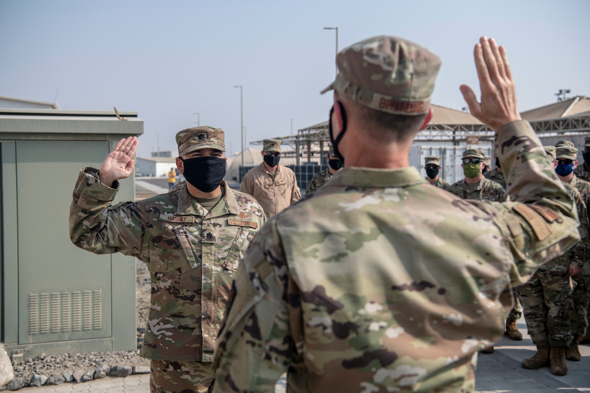 Brig. Gen. Larry Broadwell, 380th Air Expeditionary Wing commander, administers the oath of office to Lt. Col. William Hassey, 380th AEW director of staff, transferring into the U.S. Space Force during a ceremony at Al Dhafra Air Base, United Arab Emirates, Oct. 9, 2020.