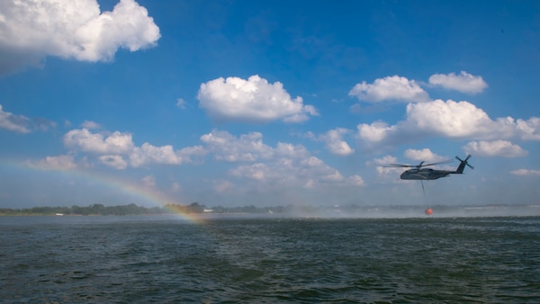 An MH-53E Sea Dragon helicopter, assigned to the "Sea Dragons" of Helicopter Mine Countermeasures Squadron (HM) 12, performs aerial firefighting training exercises using a 1,300 gallon Bambi Bucket Sept. 3, 2020.