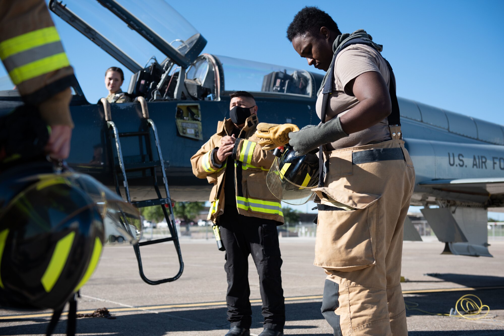 Raul Castorena, 47th Civil Engineer Squadron firefighter, instructs the firefighters on their performance and how they can improve, Sept. 30, 2020, at Laughlin Air Force Base, Texas. The exercise was done in a fair amount of time but could have been faster and been improved upon to be better prepared for real scenarios and future training. (U.S. Air Force photo by Airman 1st Class David Phaff)