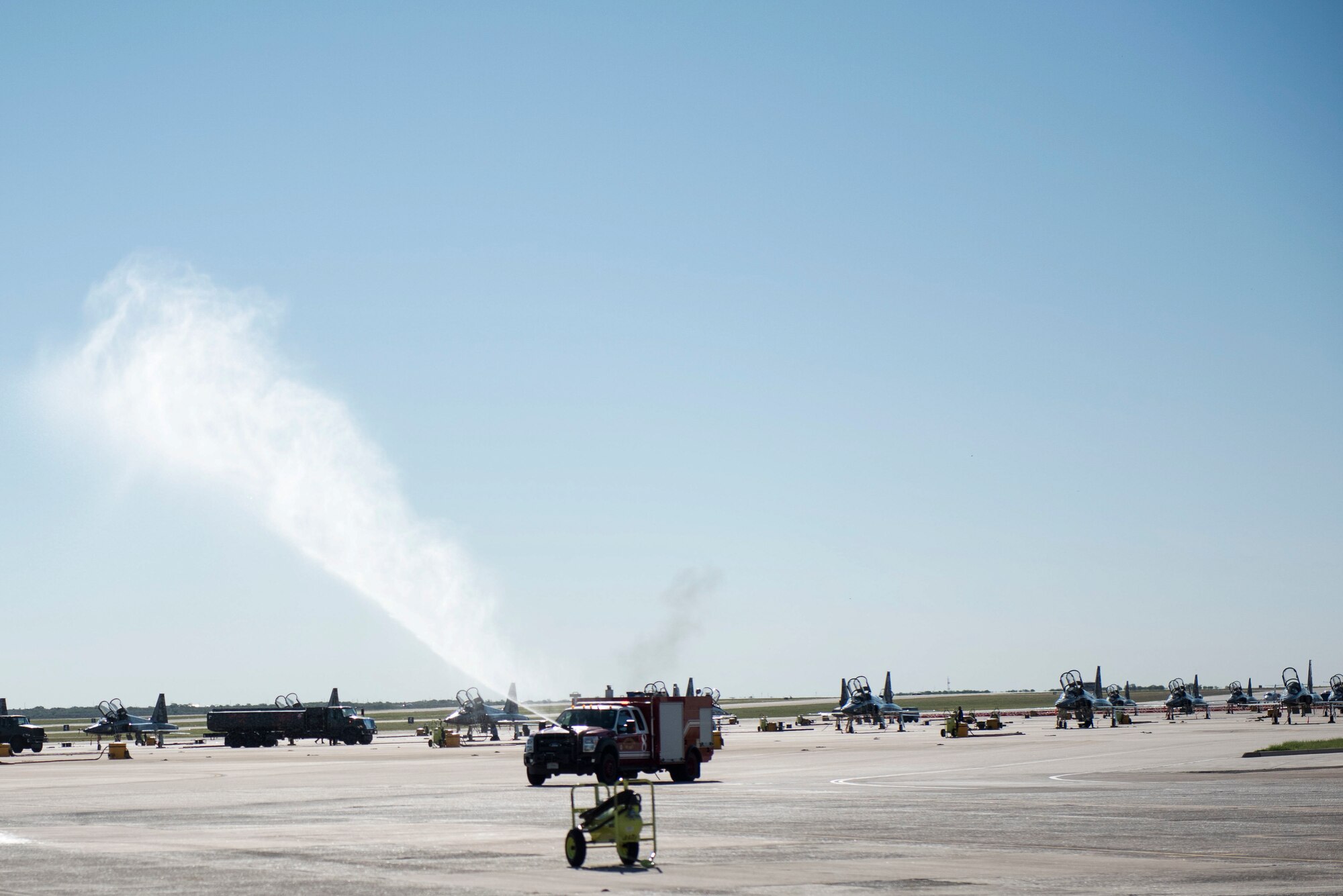 Firefighters hurry to a scenario on the flight line as a training exercise to help sharpen and hone their skills, Sept. 30, 2020, at Laughlin Air Force Base, Texas. The firefighters treat all training exercise as they were real emergencies (U.S. Air Force photo by Airman 1st Class David Phaff)