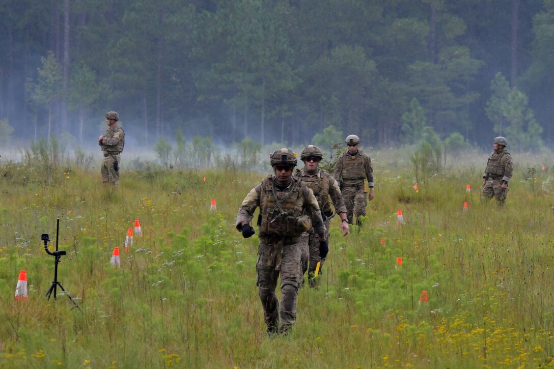Members of the 94th EOD Flight observe the aftermath of an explosion during an EOD training exercise at Ft. Stewart, Georgia, Sept 16, 2020. Throughout the exercise, members went through numerous tasks such as working with electric demolition procedures, non-electric demolition procedures, demolition shape charges and cratering charges. (U.S. Air Force photo by Airman 1st Class Kendra A. Ransum)