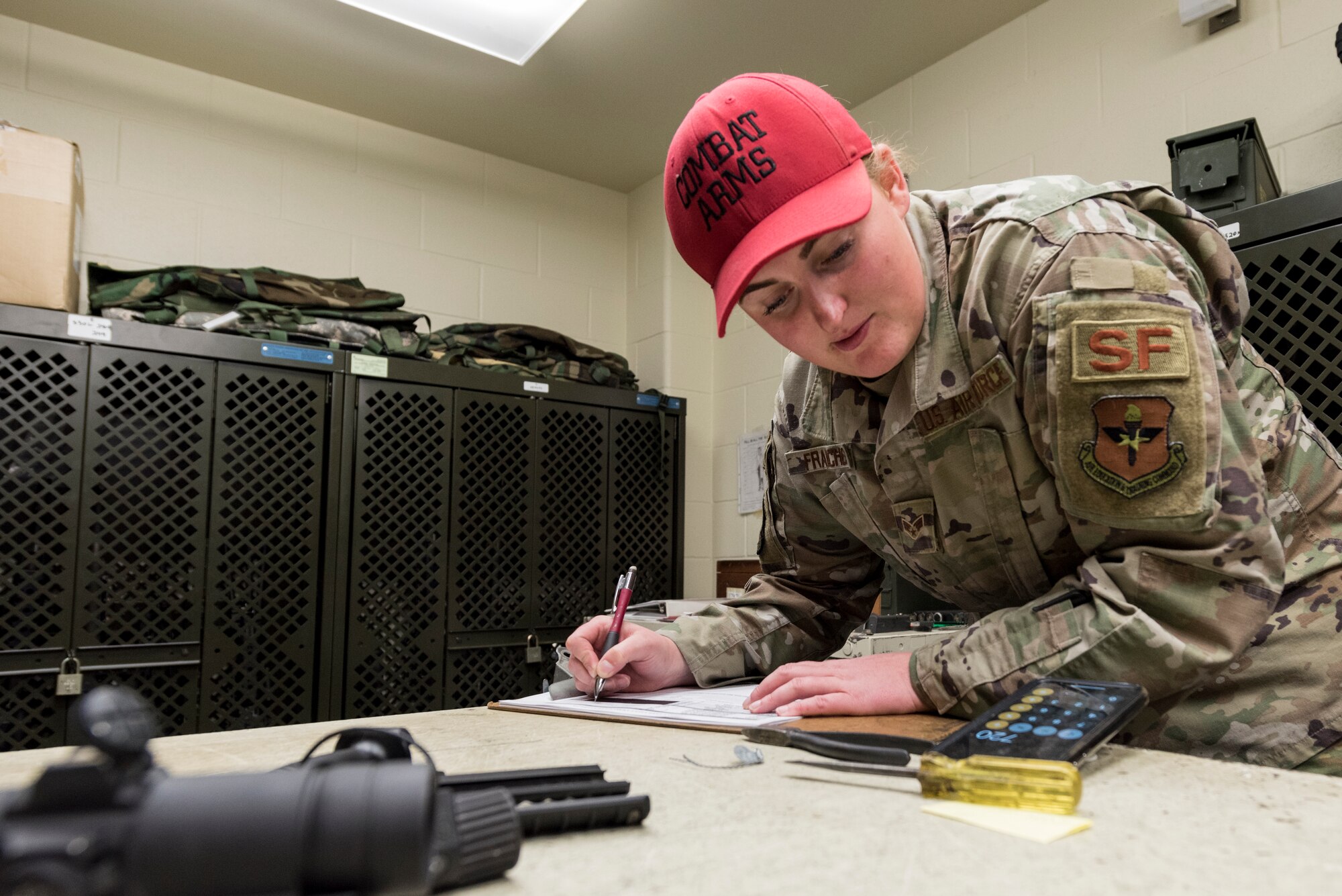 Senior Airman Lindsay Francher, 47th Security Forces Squadron Combat Arms instructor, calculates how much ammunition will be needed for the shooting portion of the day’s training, Oct. 1, 2020 at Laughlin Air Force Base, Texas. She teaches weapons knowledge in the classroom as well as the range. (U.S. Air Force photo by Senior Airman Anne McCready)