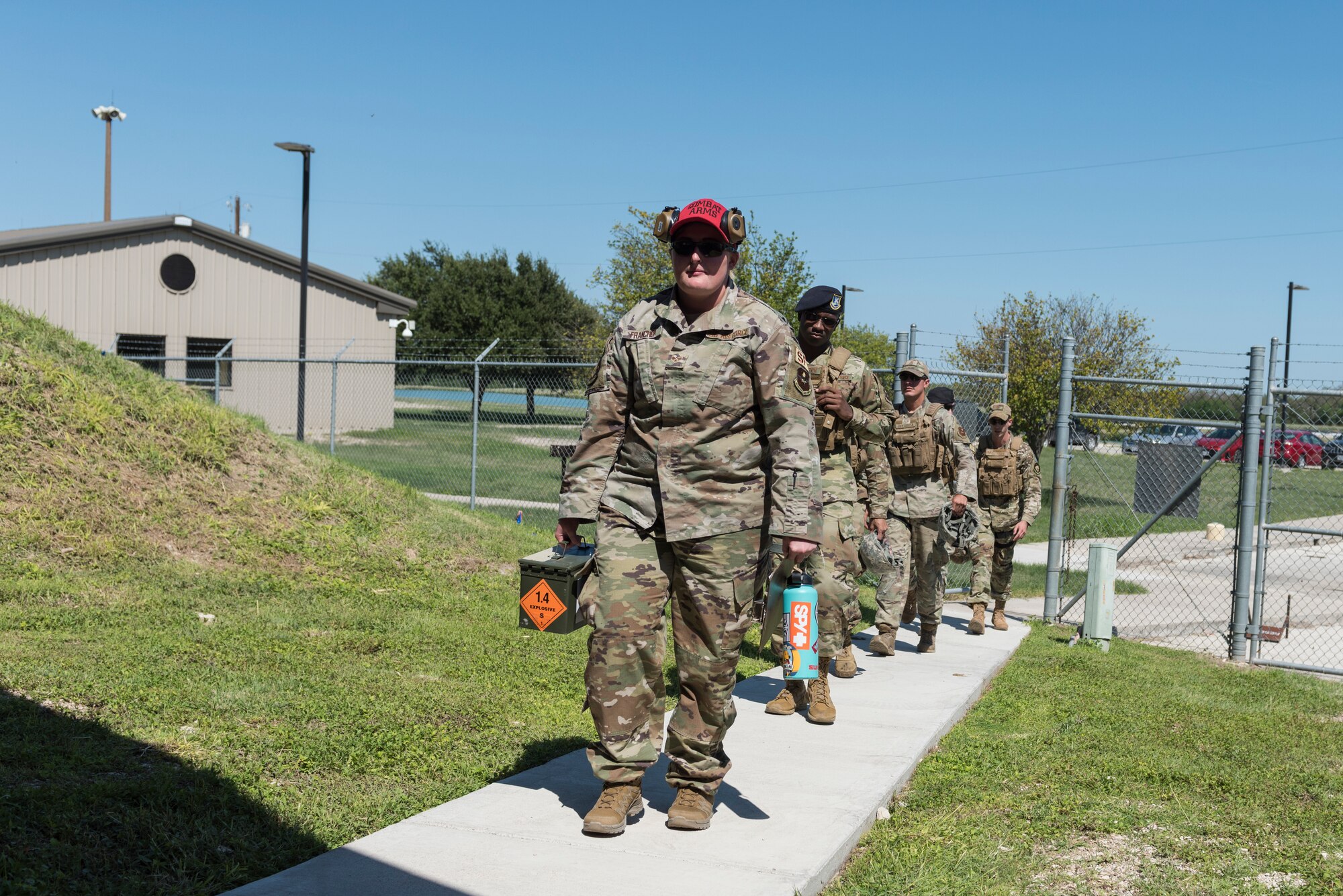 Senior Airman Lindsay Francher, 47th Security Forces Squadron Combat Arms instructor, leads her class to the range, Oct. 1, 2020, at Laughlin Air Force Base, Texas. She believes no matter how much weapons experience one has, they should go into training with an open mind and a ready ear. Those who do not, tend not to improve at the rate as the students with a humble attitude. (U.S. Air Force photo by Senior Airman Anne McCready)