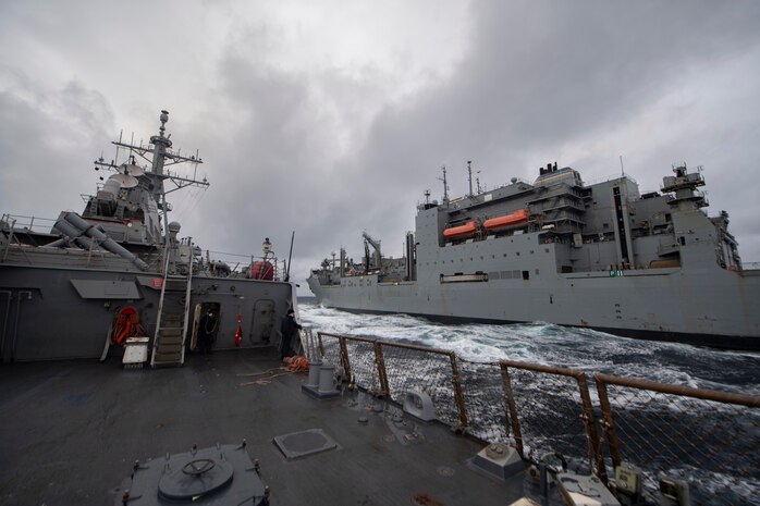 The Arleigh Burke-class guided-missile destroyer USS Donald Cook (DDG 75) and the dry cargo and ammunition ship USNS Medgar Evers (T-AKE 13) participate in a replenishment-at-sea as a part of Exercise Joint Warrior 20-2