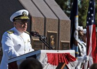 Adm. J.C. Harvey Jr., commander of U.S. Fleet Forces Command, delivers remarks at the USS Cole memorial during the 10th anniversary remembrance ceremony of the terrorist attack on Cole.
