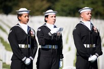 Sailors from the United States Navy Ceremonial Guard read the names of the 17 American Sailors Killed during the terrorist attack against the USS Cole during a ceremony in Arlington National Cemetery, Arlington, Va., Oct. 12, 2015.