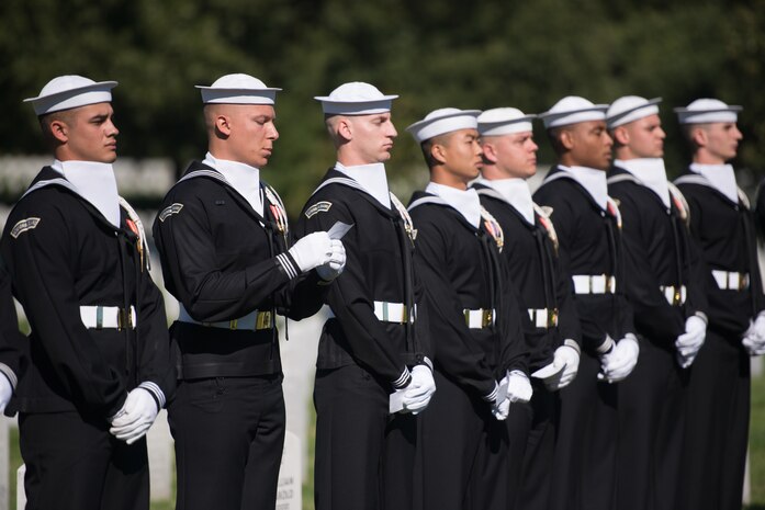 Sailors from the United States Navy Ceremonial Guard read the names of the 17 American Sailors Killed during the terrorist attack against the USS Cole during a ceremony in Arlington National Cemetery, Arlington, Va., Oct. 12, 2015.