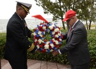 Cmdr. Mikal Phillips, USS Mason (DDG 87) commanding officer, and retired Command Master Chief James Parlier place a wreath at the Cole Memorial during the USS Cole (DDG 67) commemoration at Naval Station Norfolk.
