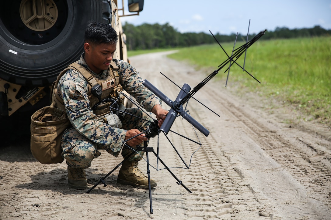 Sergeant Ferminton Maratita assembles a satellite communication antenna during a Marine Corps Air-Ground Task Force exercise on Camp Lejeune, NC, June 8, 2020. The exercise is designed to increase the MEU’s proficiency and enhance their capabilities as a MAGTF. Maratita is a radio operator with the 24th Marine Expeditionary Unit. (U.S. Marine Corps photo by Cpl. Margaret Gale)