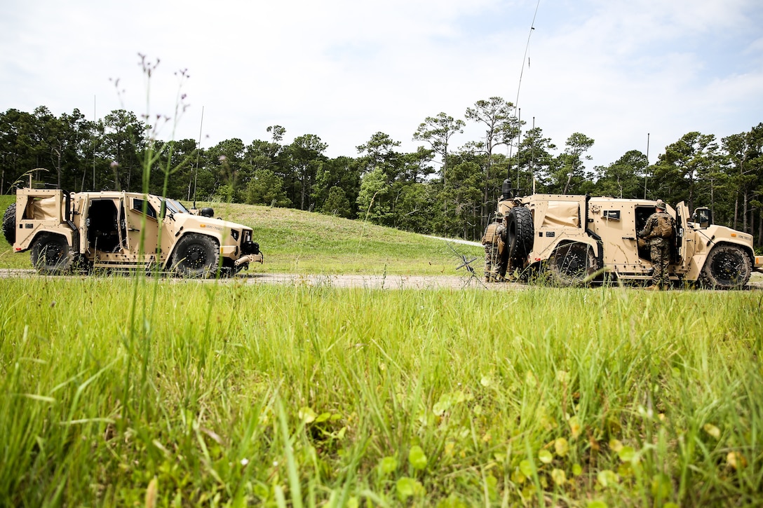 Marines with the 24th Marine Expeditionary Unit’s communication section test equipment from Joint Light Tactical Vehicles at Camp Lejeune June 8, 2020 as part of Marine Air-Ground Task Force Exercise. The exercise is designed to increase the MEU’s proficiency and enhance their capabilities as a MAGTF. (U.S. Marine Corps photo by Cpl. Margaret Gale)
