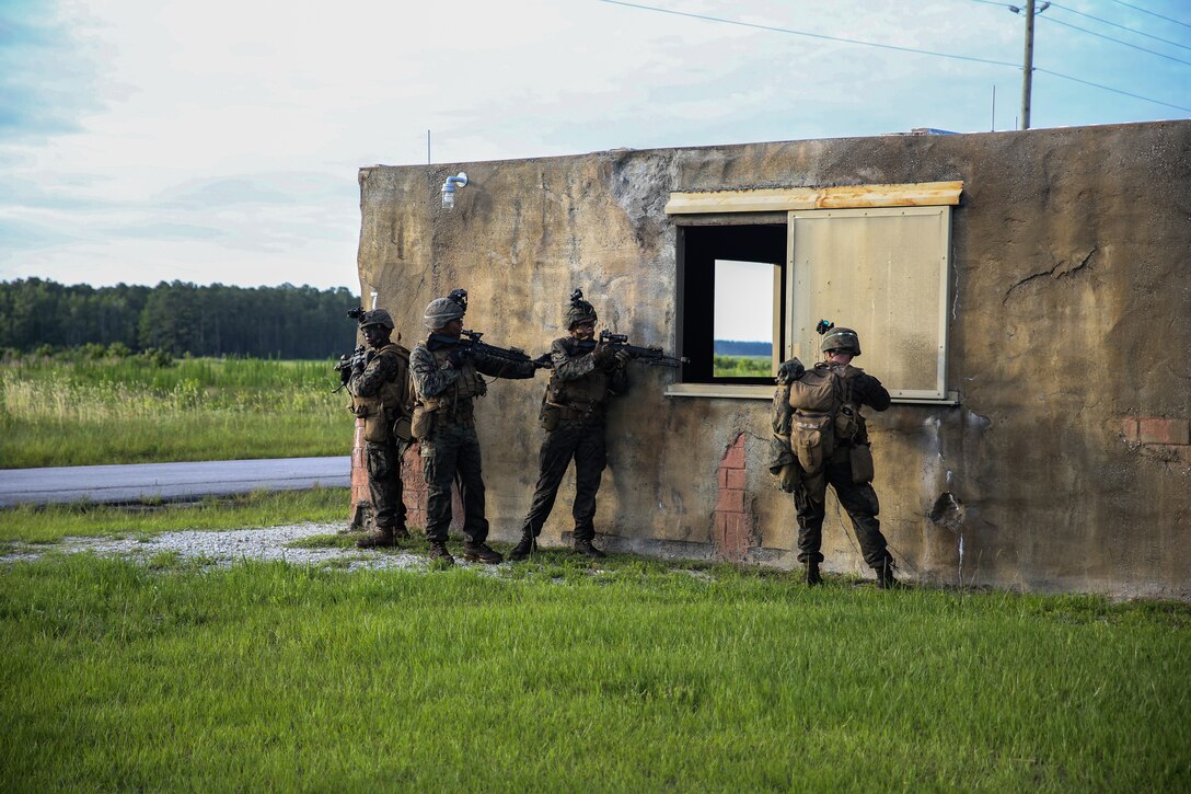 Marines rehearse an airfield assault and seizure simulation at Marine Corps Outlying Landing Field, Camp Davis, NC, June 9, 2020. The simulation was a part of a Marine Corps Air-Ground Task Force exercise with the 24th Marine Expeditionary Unit. The exercise is designed to increase the MEU’s proficiency and enhance their capabilities as a MAGTF. The Marines are with 1st Battalion, 8th Marine Regiment. (U.S. Marine Corps photo by Cpl. Margaret Gale)