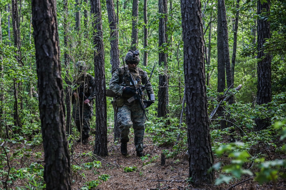 Marines participate in an airfield assault and seizure simulation at Marine Corps Outlying Landing Field, Camp Davis, NC, June 9, 2020. The simulation was a part of a Marine Corps Air-Ground Task Force exercise with the 24th Marine Expeditionary Unit. The exercise is designed to increase the MEU’s proficiency and enhance their capabilities as a MAGTF. The Marines are with 1st Battalion, 8th Marine Regiment. (U.S. Marine Corps photo by Cpl. Margaret Gale)