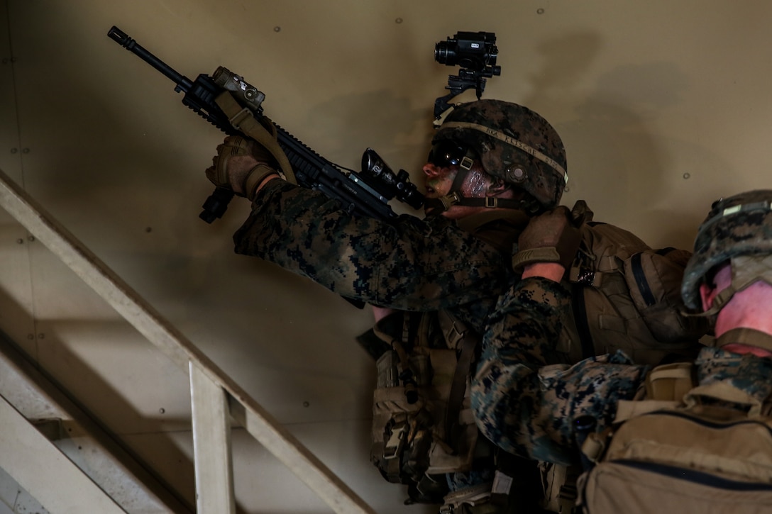 Marines rehearse Military Operations on Urbanized Terrain tactics during an airfield assault and seizure simulation at Marine Corps Outlying Landing Field, Camp Davis, NC, June 9, 2020. The simulation was a part of a Marine Corps Air-Ground Task Force exercise with the 24th Marine Expeditionary Unit. The exercise is designed to increase the MEU’s proficiency and enhance their capabilities as a MAGTF. The Marines are with 1st Battalion, 8th Marine Regiment. (U.S. Marine Corps photo by Cpl. Margaret Gale)