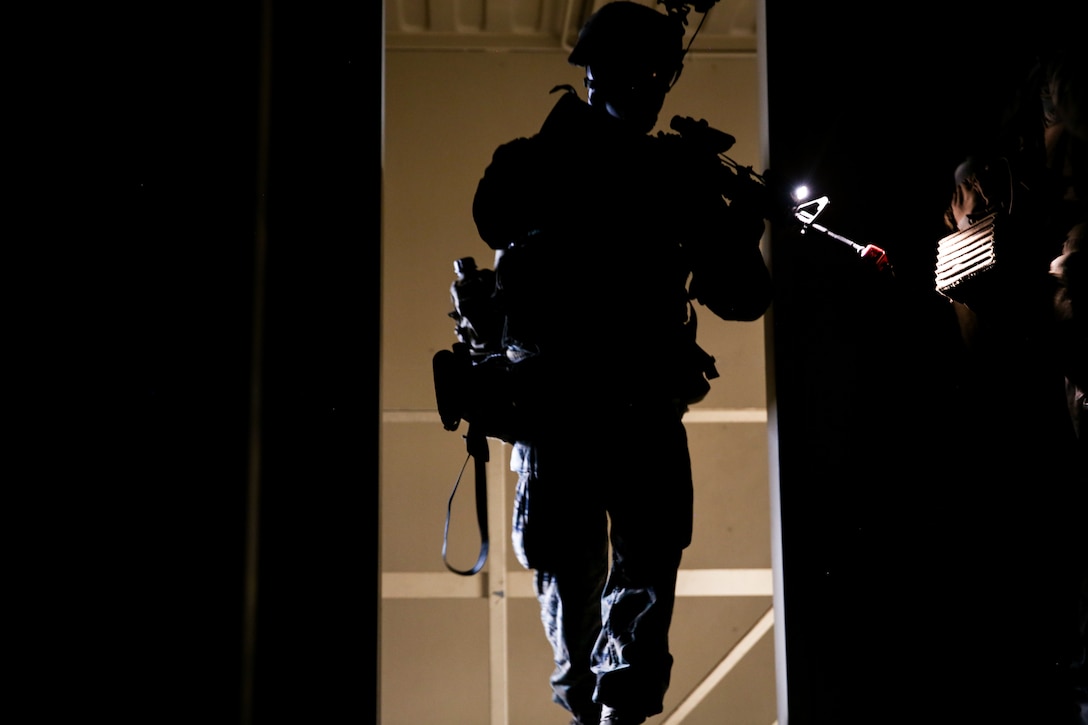 A Marine rehearses Military Operations on Urbanized Terrain tactics during an airfield assault and seizure simulation at Marine Corps Outlying Landing Field, Camp Davis, NC, June 9, 2020. The simulation was a part of a Marine Corps Air-Ground Task Force exercise with the 24th Marine Expeditionary Unit. The exercise is designed to increase the MEU’s proficiency and enhance their capabilities as a MAGTF. The Marine is with 1st Battalion, 8th Marine Regiment. (U.S. Marine Corps photo by Cpl. Margaret Gale)