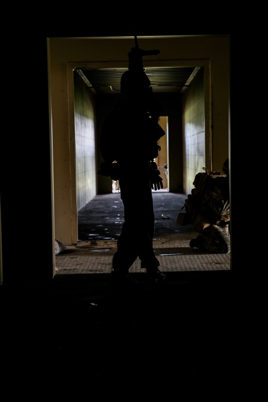 A Marine participates in an airfield assault and seizure simulation at Marine Corps Outlying Landing Field, Camp Davis, NC, June 9, 2020. The simulation was a part of a Marine Corps Air-Ground Task Force exercise with the 24th Marine Expeditionary Unit. The exercise is designed to increase the MEU’s proficiency and enhance their capabilities as a MAGTF. The Marine is with 1st Battalion, 8th Marine Regiment. (U.S. Marine Corps photo by Cpl. Margaret Gale)