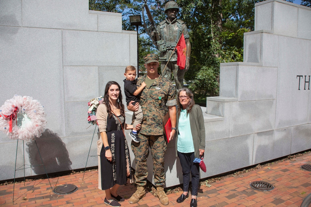 U.S. Navy Corpsman HM1 Michael D. Bryson, poses for a photo with his wife Summer, his son Benjamin, and grandmother Patricia at an award ceremony at Camp Lejeune, N.C., September 22, 2020. Bryson received the Chief Hospital Corpsman George William “Doc” Piercy award, which recognizes one Navy corpsmen who has earned the Fleet Marine Force (FMF) badge for contributing to the combat readiness of any air or ground element in the Marine Corps. Bryson also received a Navy Commendation Medal for his outstanding service and accomplishments while serving as a corpsman for 1st Battalion 8th Marine Regiment. (U.S. Marine Corps photo by Lance Cpl. Nicholas Guevara)