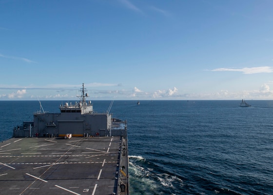An Italian NH 90 helicopter assigned to the Italian Navy frigate ITS Federico Martinengo (F 596) flies over participants in the French-led exercise Grand African NEMO in the Gulf of Guinea, Oct. 8, 2020.