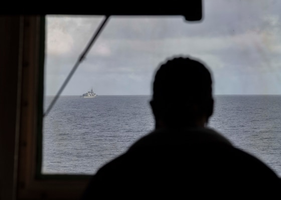 The Arleigh Burke-class guided-missile destroyer USS Donald Cook (DDG 75) and the dry cargo and ammunition ship USNS Medgar Evers (T-AKE 13) participate in a replenishment-at-sea as a part of Exercise Joint Warrior 20-2