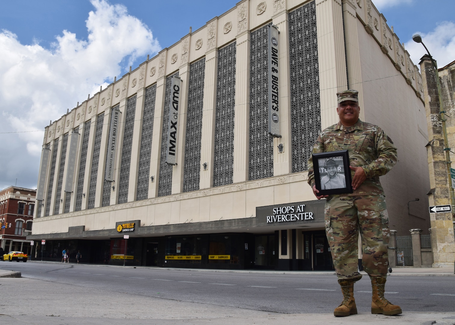 Chief Master Sgt. Joe G. Gonzalez Jr., 433rd Mission Support Group, group superintendent, holds a picture of his father, Joe G. Gonzalez Sr., in front of the Joske’s Department Store building, Oct. 9, 2020 in San Antonio. Gonzalez stated that his father, a welder, worked on the steel décor between the building’s columns. The building is part of the National Register of Historic Places-listed and City of San Antonio Alamo Plaza Historic District and is a City of San Antonio local landmark (U.S. Air Force photo by Tech. Sgt. Iram Carmona)